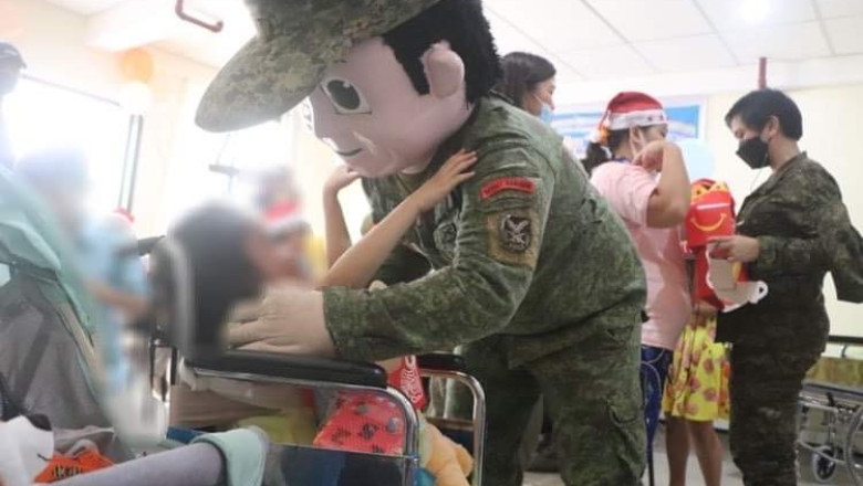 Special children receive gifts from soldiers