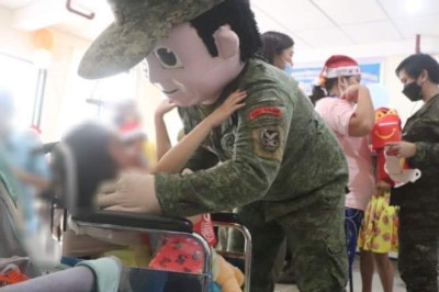 Special children receive gifts from soldiers